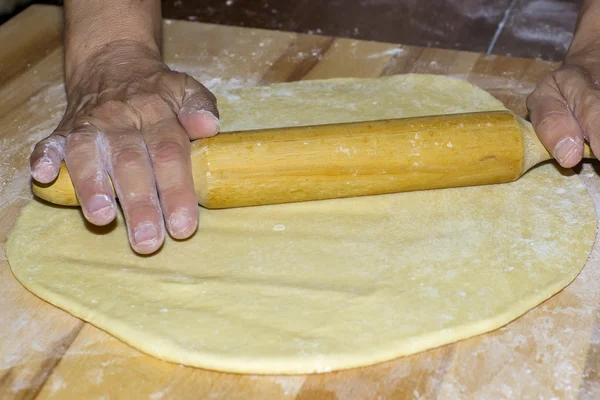 Hands with rolling kneading dough — Stock Photo, Image