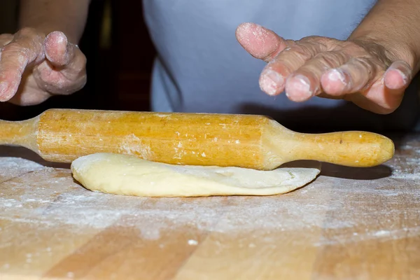 Hands with rolling kneading dough — Stock Photo, Image