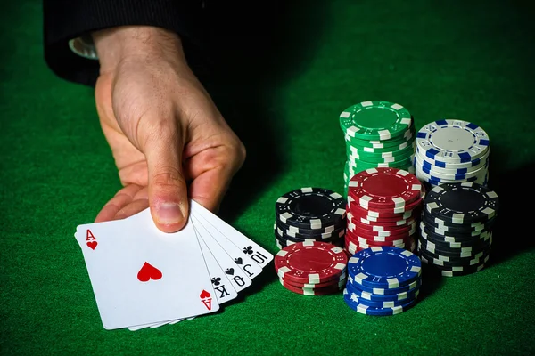 Flush in poker and betting chips — Stock Photo, Image
