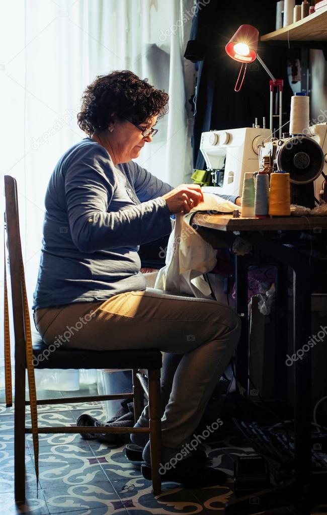 middle aged woman sewing