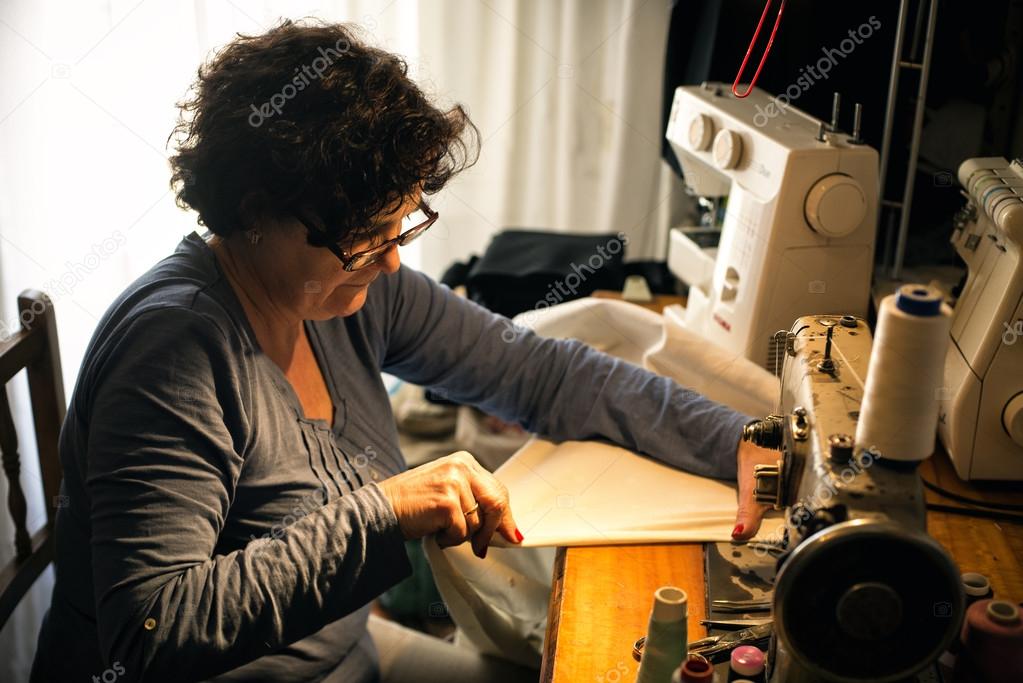 Middle aged woman sewing