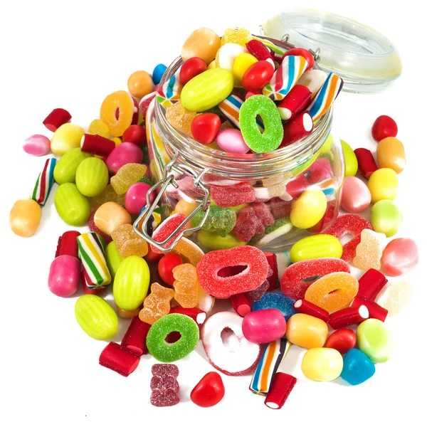 Glass jar full of candies isolated in white background — Stock Photo, Image