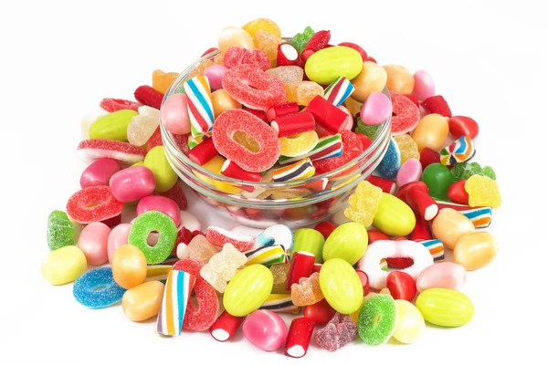 Glass jar full of candies isolated in white background — Stock Photo, Image