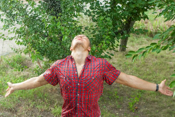 Sexy young man wet in rain — Stock Photo, Image
