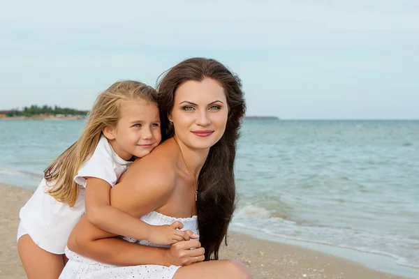 Mother and her little daughter hugging. — Stock Photo, Image