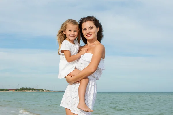 Mother and her little daughter hugging. — Stock Photo, Image