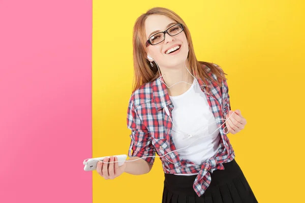 Woman dancing with headphones listening to music on smartphone. — Stock Photo, Image