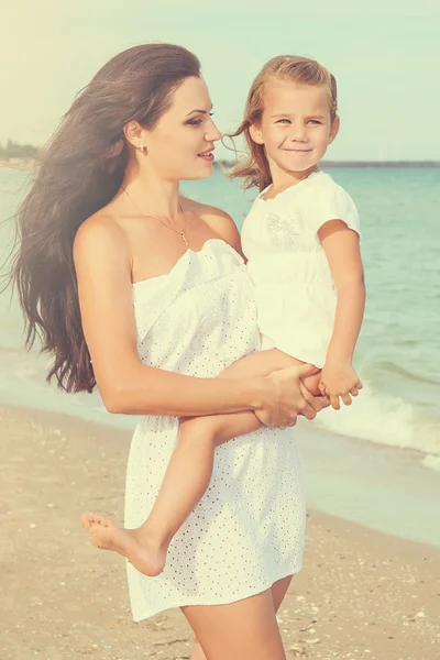 Mother and her little daughter hugging. — Stock Photo, Image