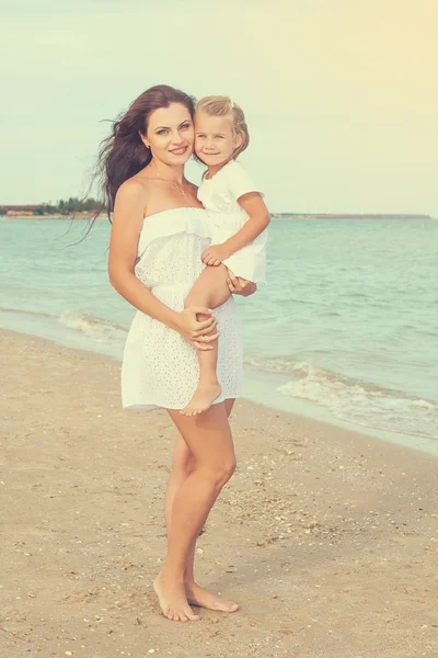 Mother and her little daughter hugging. — Stock Photo, Image