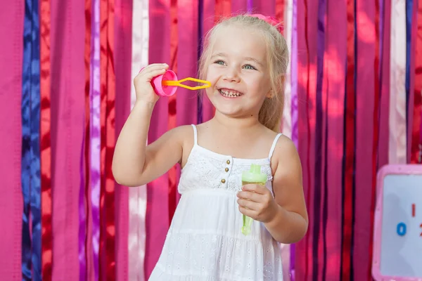 Happy little girl with soap bubbles — Stock Photo, Image