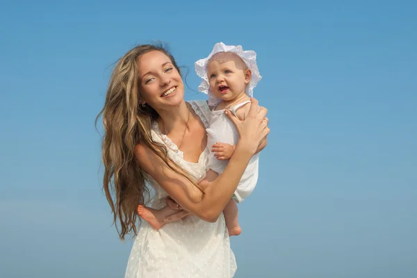 Happy beautiful mother and daughter enjoying — Stock Photo, Image