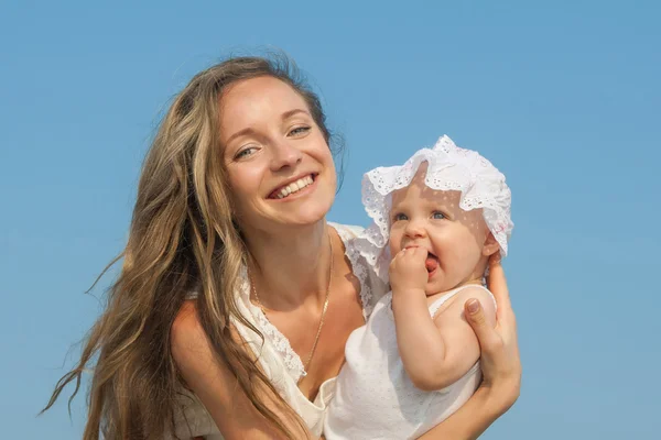 Happy beautiful mother and daughter enjoying — Stock Photo, Image