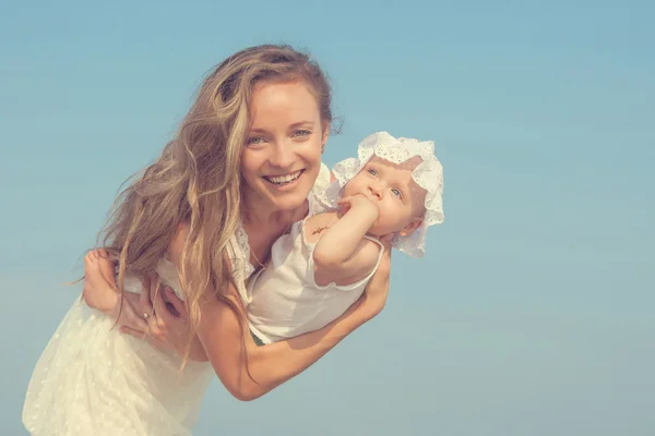 Happy beautiful mother and daughter enjoying — Stock Photo, Image