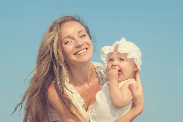 Happy beautiful mother and daughter enjoying — Stock Photo, Image