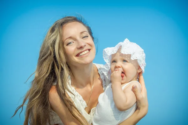 Happy beautiful mother and daughter enjoying — Stock Photo, Image