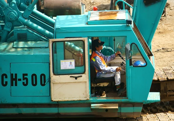 People control excavator — Stock Photo, Image