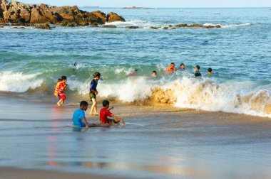 Asian children, swim, Vietnam beach 