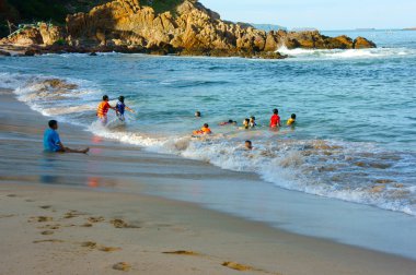 Asian children, swim, Vietnam beach 