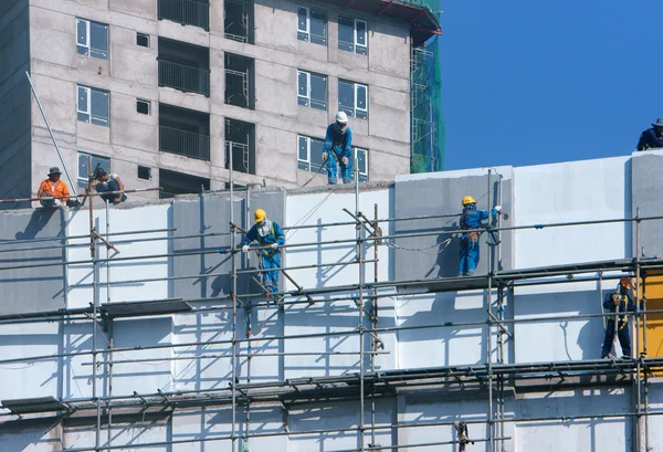 Trabalhador da construção asiática scraffold, local de construção — Fotografia de Stock