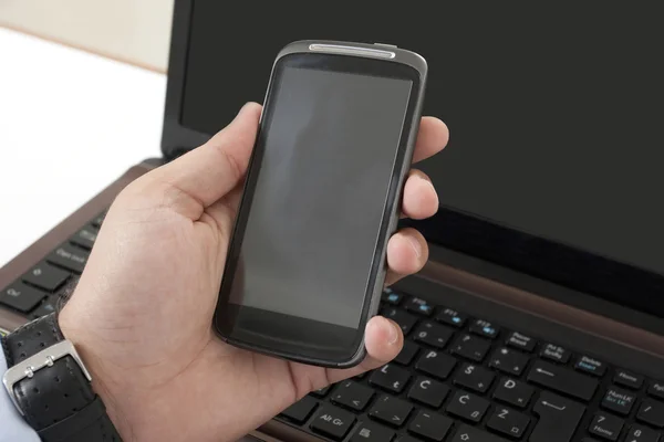 Office worker shows his mobile phone — Stock Photo, Image