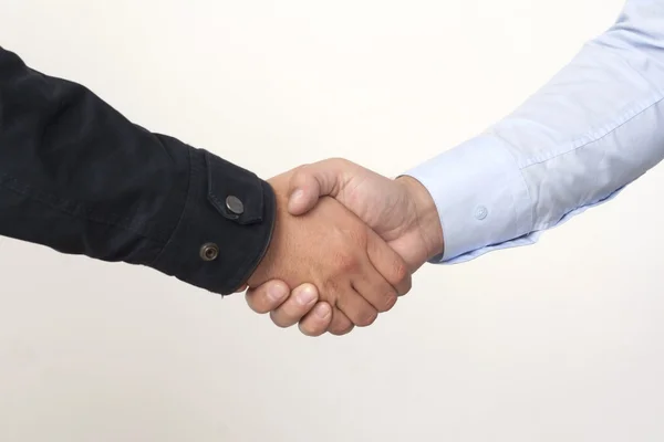 Farmer and businessman shaking hands