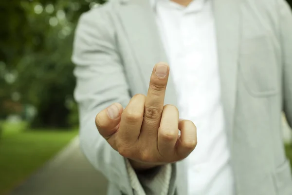 Hombre de negocios mostrando el dedo medio — Foto de Stock