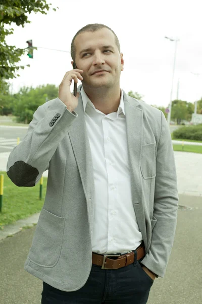 Entrepreneur calling with a Mobile Phone