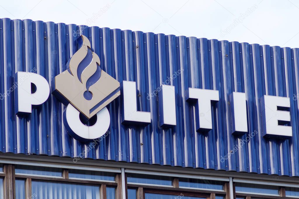 Nijmegen, Netherlands - January 14, 2021: Dutch police logo on a facade of a police building