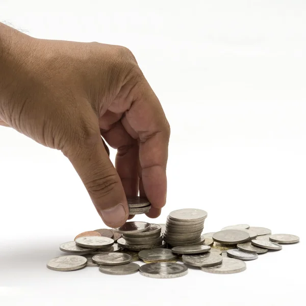 Ręka, zbierając kilka monet — Zdjęcie stockowe
