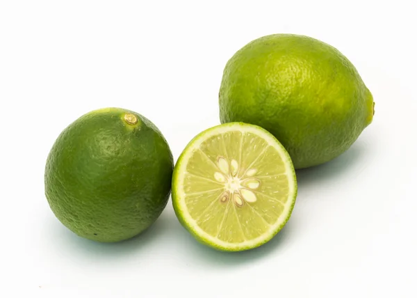 Isolated fresh limes and slice on white background — Stock Photo, Image