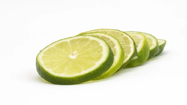 Isolated fresh lime slices on white background — Stock Photo, Image