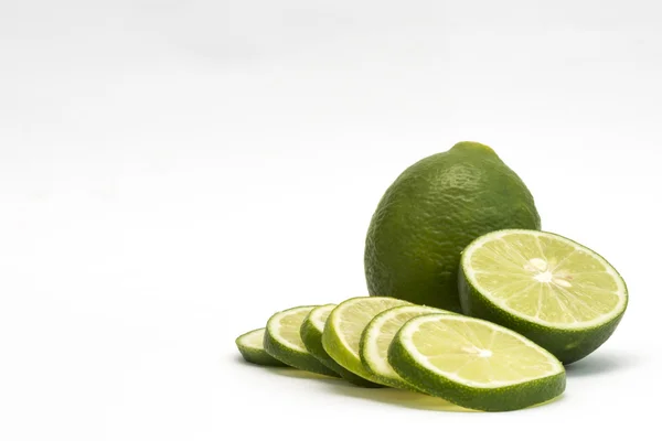 Isolated fresh lime and slices on white backgroundwith copy spac — Stock Photo, Image