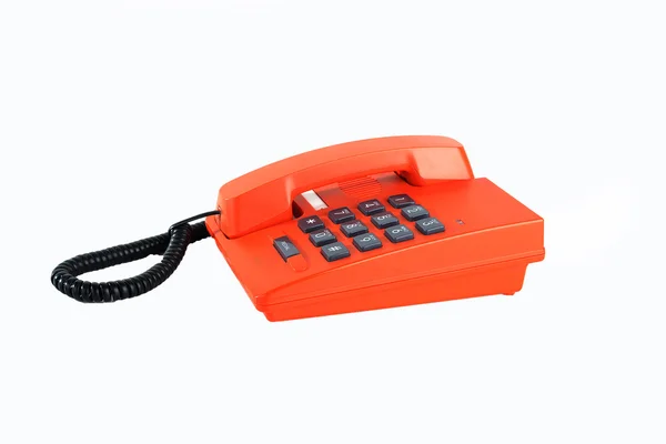 Orangefarbenes Retro-Telefon auf weißem Hintergrund — Stockfoto