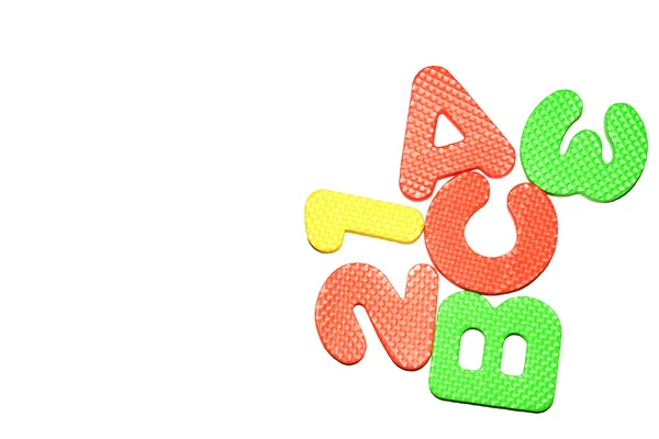 Alfabet puzzle, strzelectwo kolorowe w tle — Zdjęcie stockowe