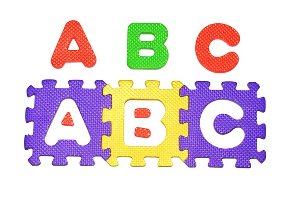 Alphabet Puzzle bunte Schießen auf weißem Hintergrund — Stockfoto