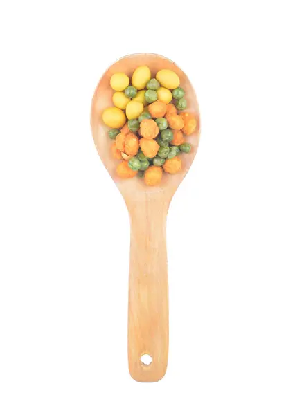 Snack nuts in a wooden spoon — Stock Photo, Image