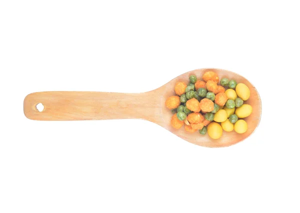 Snack nuts in a wooden spoon — Stock Photo, Image