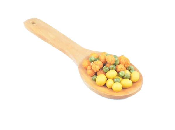 Snack nuts in a wooden spoon — Stock Photo, Image