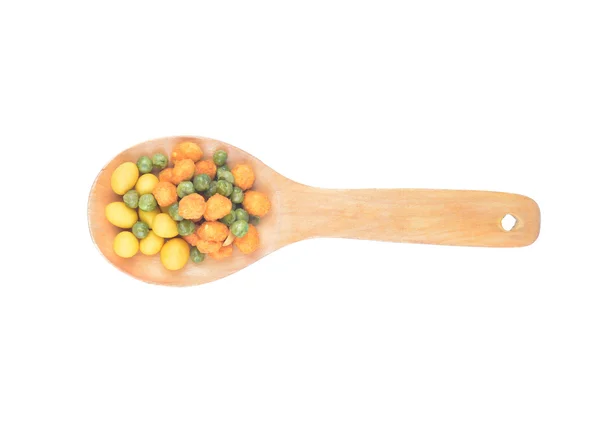 Snack nuts in a wooden spoon — Stock Photo, Image