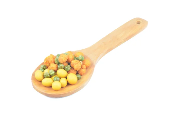 Snack nuts in a wooden spoon — Stock Photo, Image