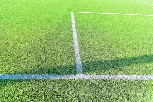 Goal post on green field ,white line football corner on green field.