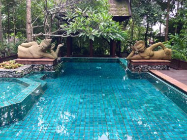 The pool with the stone statues in Chiang mai,Thailand