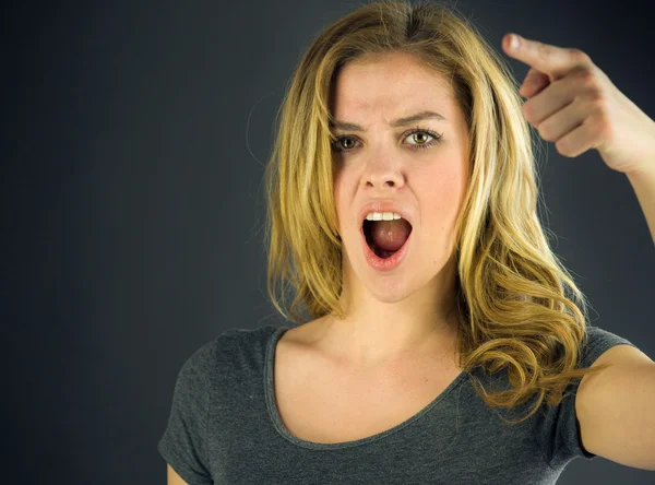 Woman scolding with finger — Stock Photo, Image