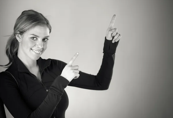 Woman pointing away with fingers — Stock Photo, Image
