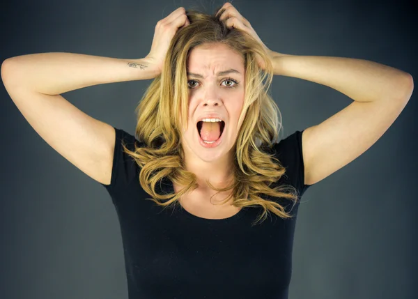 Stressed woman pulling hairs