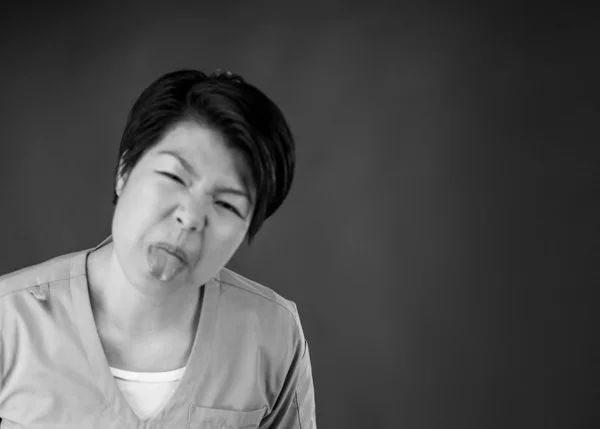 Woman sticking tongue out — Stock Photo, Image