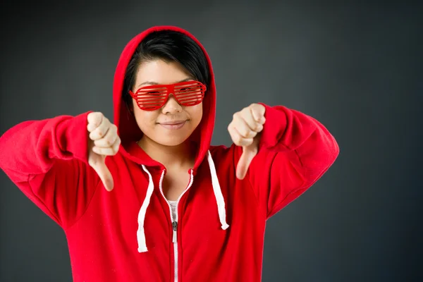 Woman gesturing thumbs down sign — Stock Photo, Image