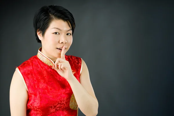 Woman asking for silence with finger on lips — Stock Photo, Image