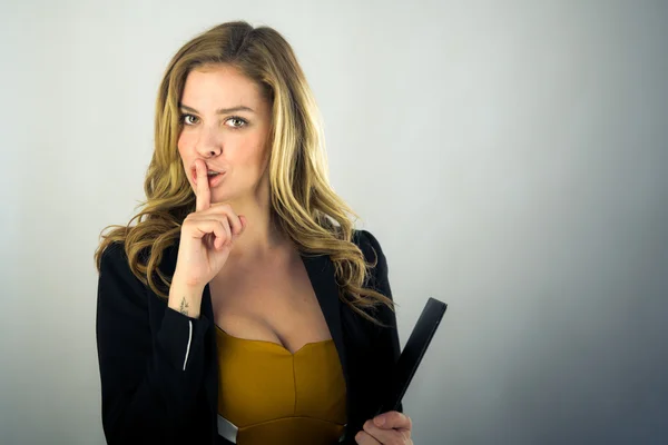 Woman asking for silence with finger on lips — Stock Photo, Image