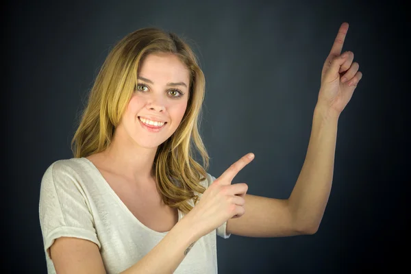 Woman pointing to camera with fingers — Stock Photo, Image